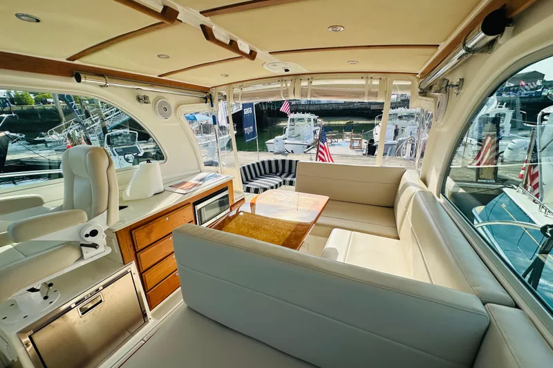 Watermark Yacht Photos Pics Luxurious interior of a 2017 Back Cove 32 yacht with seating and wooden accents.