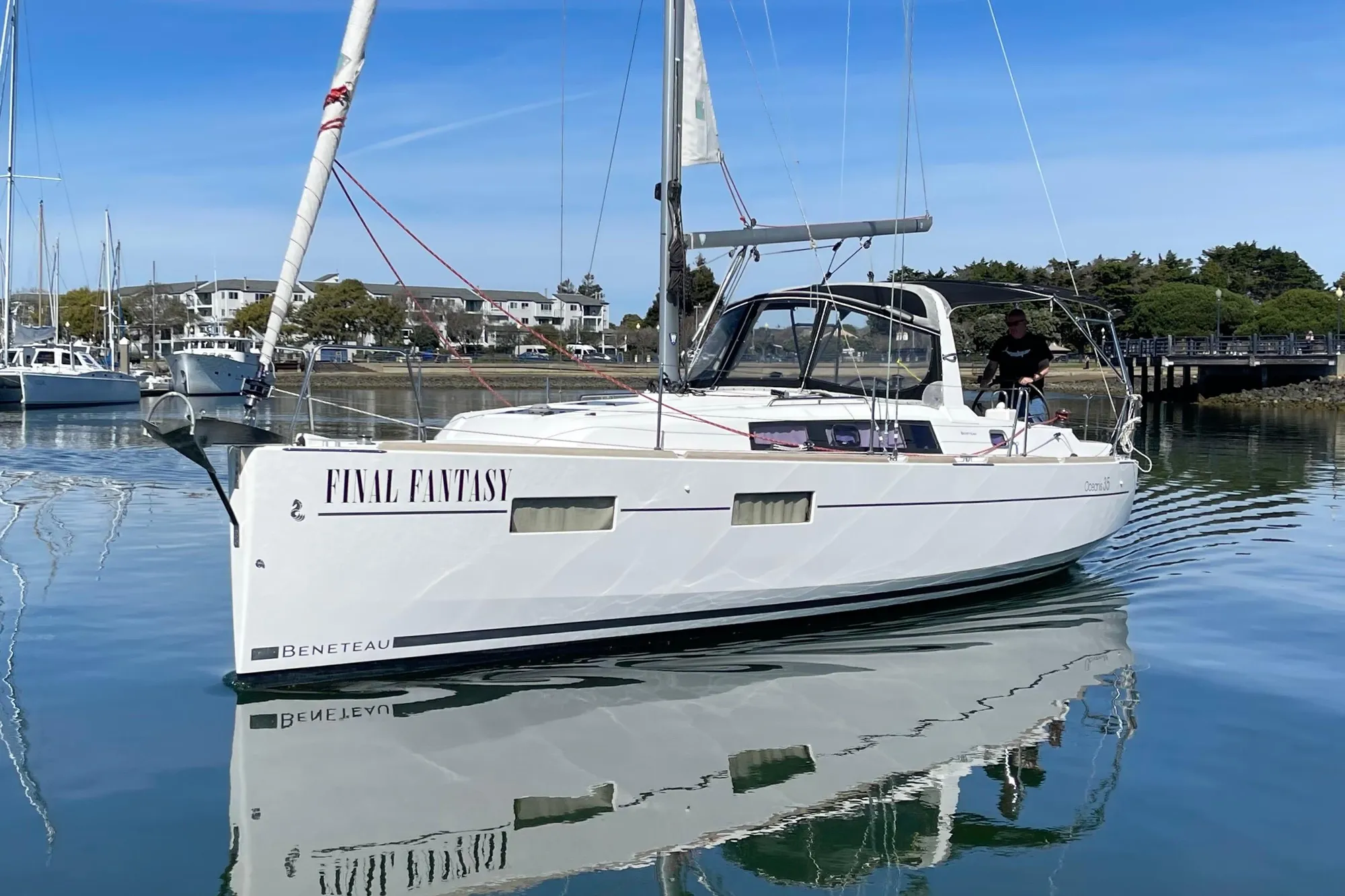 Beneteau First 235 sailboat, 2015 model, named "Final Fantasy" on calm water.