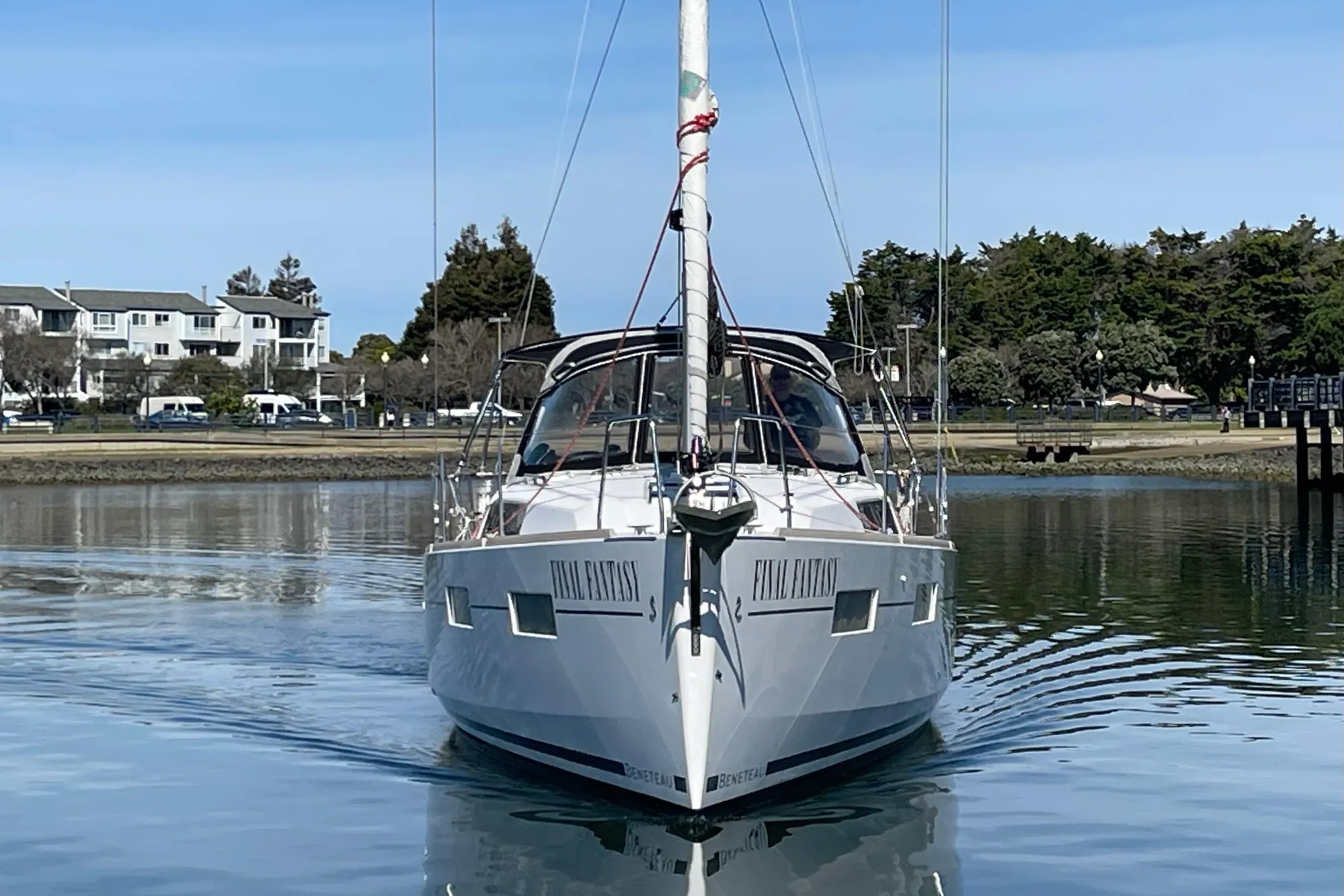 Sailboat "Final Fantasy," Beneteau First 235, 2015 model, on calm water near shoreline.