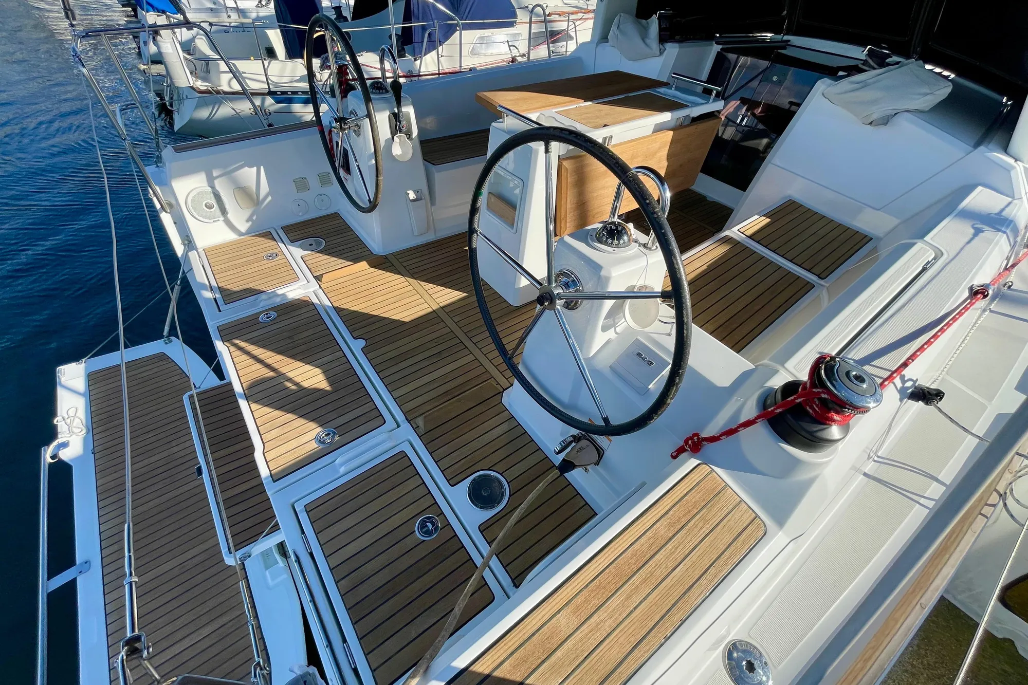 2015 Beneteau First 235 sailboat cockpit with dual steering wheels and teak decking.