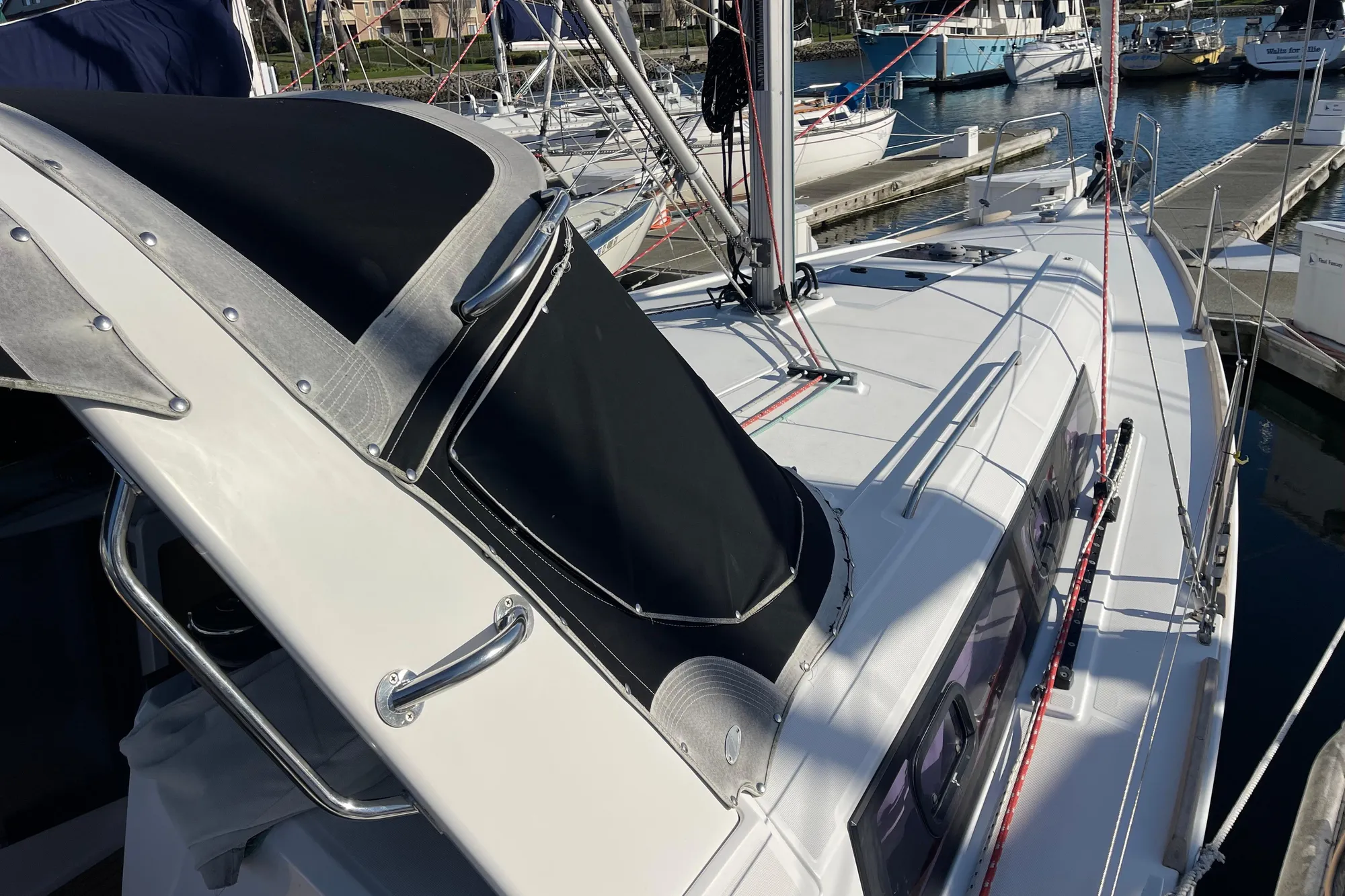 2015 Beneteau First 235 sailboat docked at marina, showcasing sleek design and rigging.