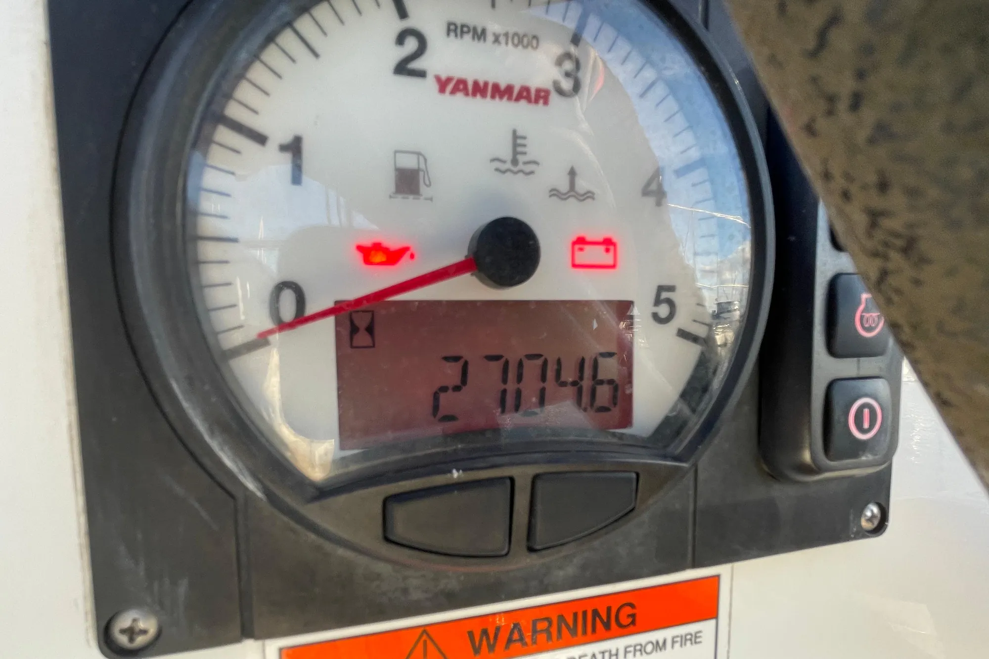 Yanmar engine gauge on 2015 Beneteau First 235, displaying 2704.6 hours.