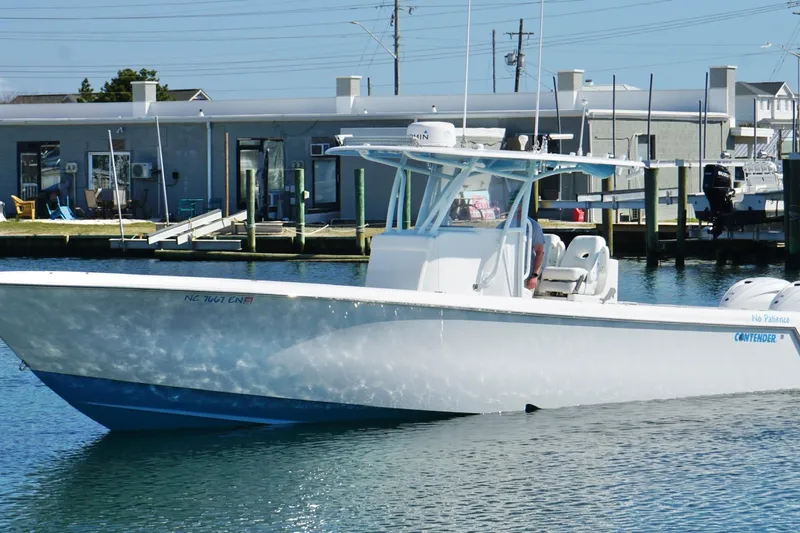 Yacht Photos Pics 2020 Contender 35 ST boat docked in marina, clear blue water, sunny day.