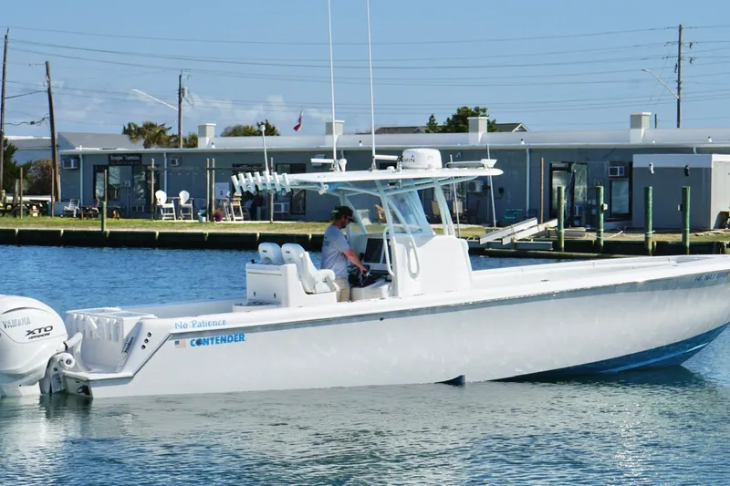  Yacht Photos Pics 2020 Contender 35 ST boat on water near dockside buildings.