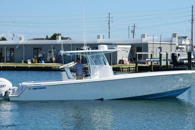  Yacht Photos Pics 2020 Contender 35 ST boat docked at marina, clear sky background.