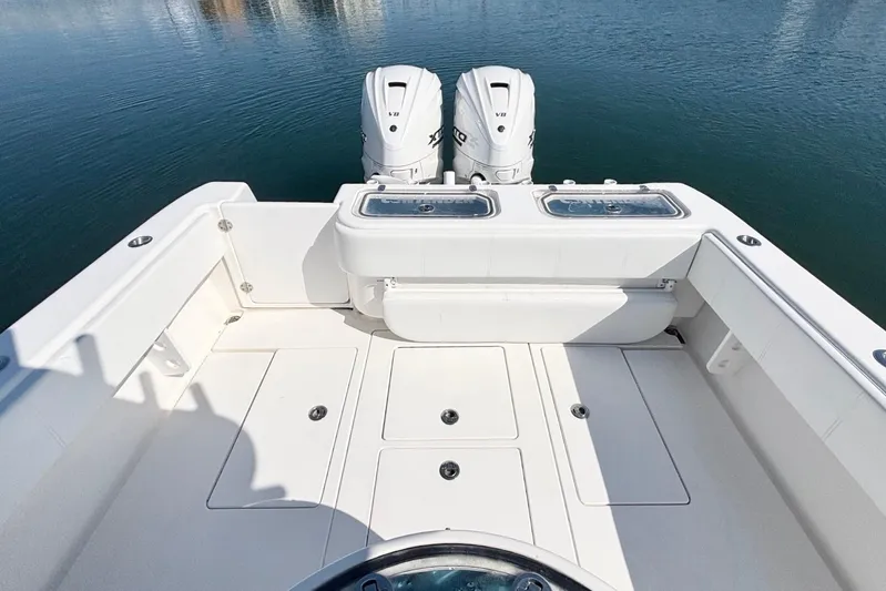  Yacht Photos Pics 2020 Contender 35 ST boat deck with twin engines on calm water.