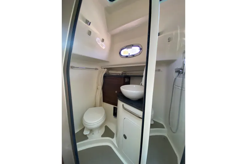  Yacht Photos Pics 2021 Boston Whaler 345 Conquest bathroom with toilet, sink, and shower.