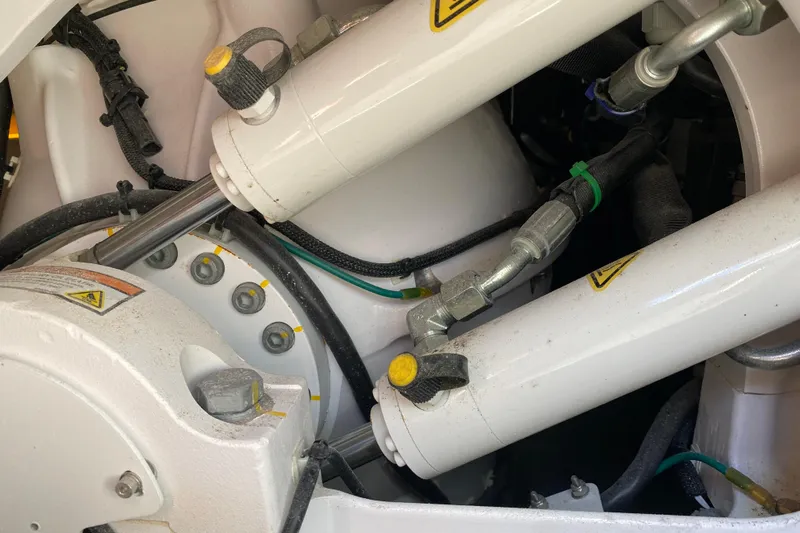  Yacht Photos Pics Close-up of hydraulic system components on a 2021 Boston Whaler 345 Conquest boat.