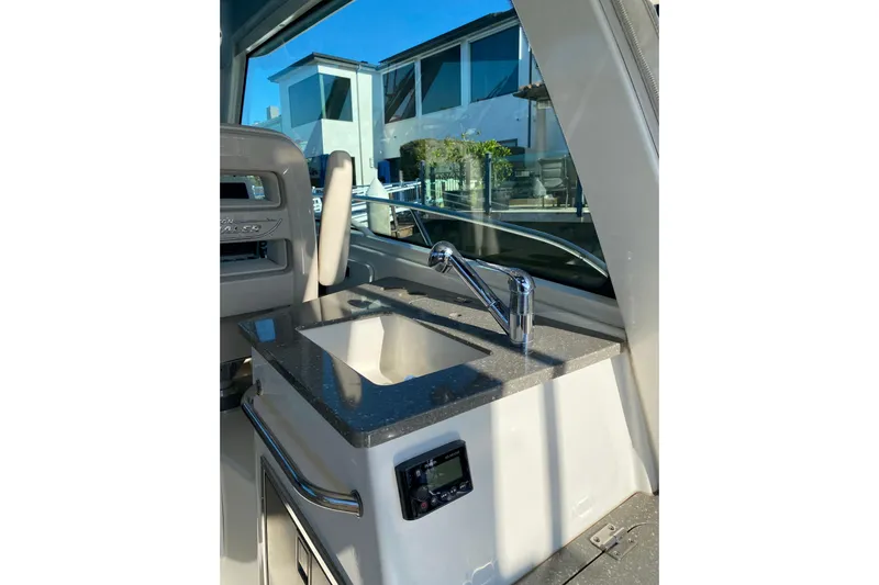  Yacht Photos Pics 2021 Boston Whaler 345 Conquest interior with sleek sink and modern faucet.