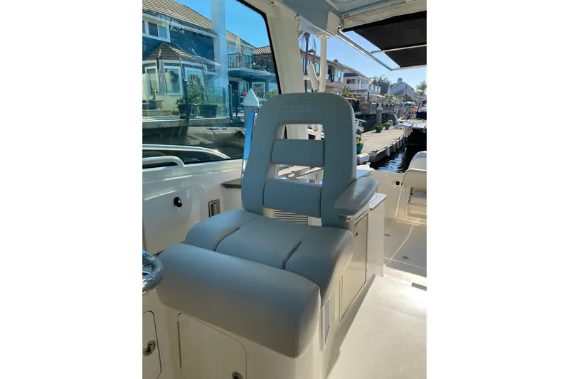  Yacht Photos Pics Captain's chair on 2021 Boston Whaler 345 Conquest, dockside view.
