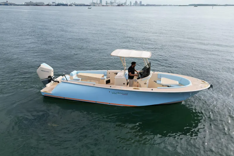  Yacht Photos Pics 2026 Lilybaeum Levanzo 25 Lounge Deck boat on calm water, featuring a sleek design.