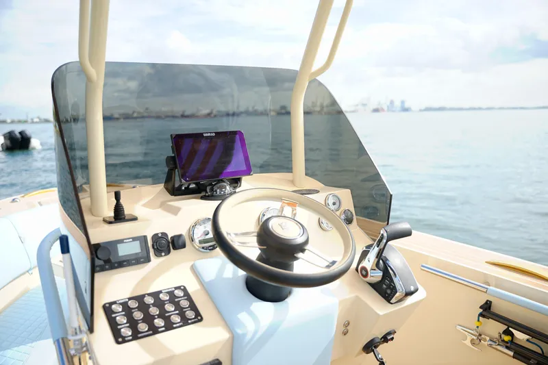  Yacht Photos Pics Steering console of 2026 Lilybaeum Levanzo 25 Lounge Deck boat on calm water.