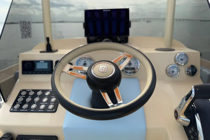  Yacht Photos Pics Steering wheel and dashboard of 2026 Lilybaeum Levanzo 25 Lounge Deck boat.