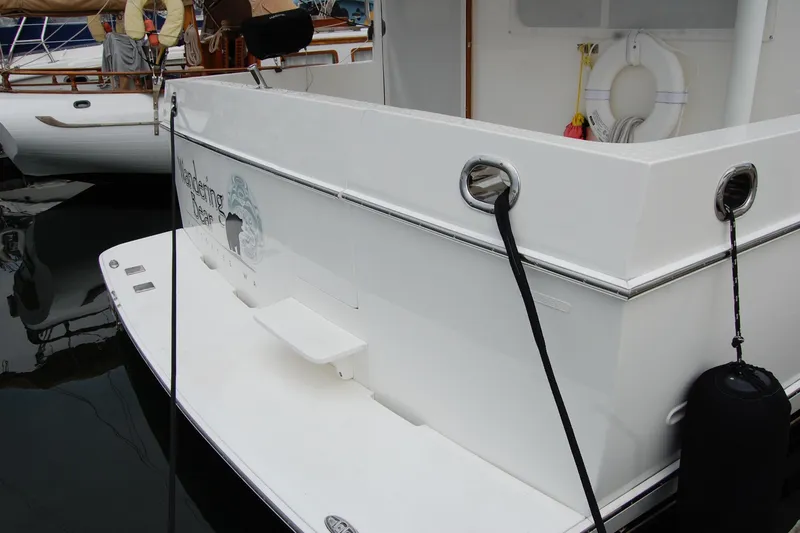 Wandering Bear Yacht Photos Pics 2001 Ocean Alexander Classico yacht stern view with dock lines and fender.