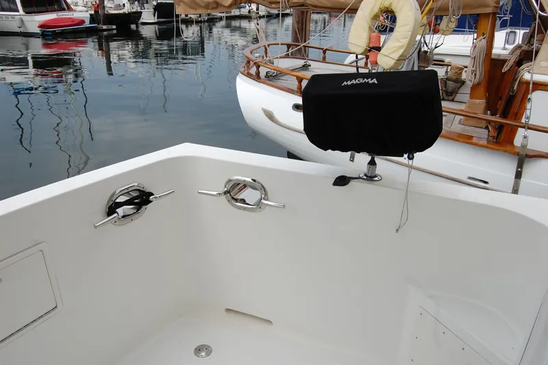 Wandering Bear Yacht Photos Pics Cockpit view of 2001 Ocean Alexander Classico yacht with docked boats in background.