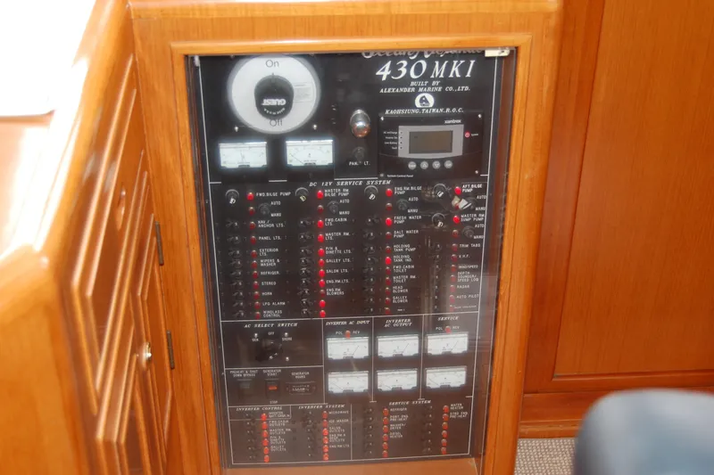 Wandering Bear Yacht Photos Pics Control panel of a 2001 Ocean Alexander Classico yacht, featuring various switches and gauges.