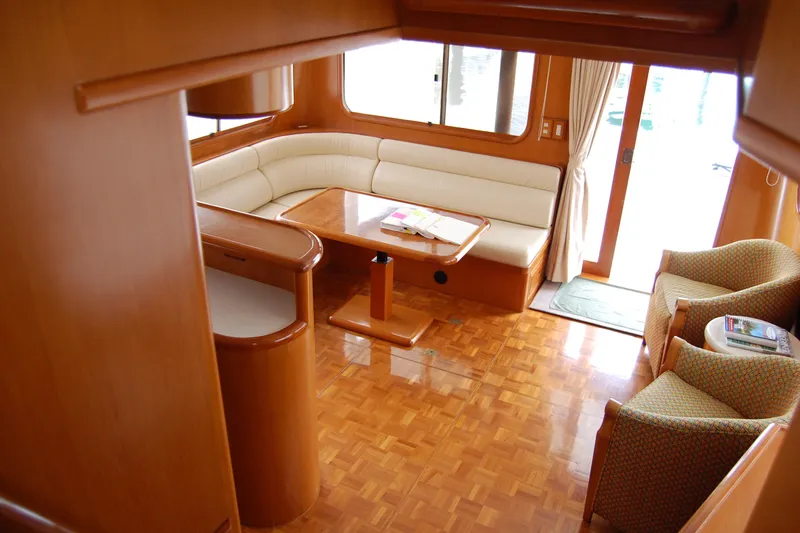 Wandering Bear Yacht Photos Pics Luxurious 2001 Ocean Alexander Classico yacht interior with elegant wood finish and comfortable seating.
