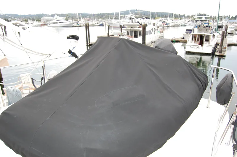 Wandering Bear Yacht Photos Pics Covered deck of 2001 Ocean Alexander Classico yacht in a marina setting.