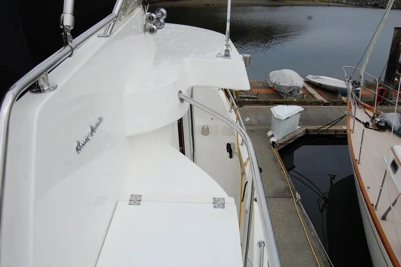 Wandering Bear Yacht Photos Pics 2001 Ocean Alexander Classico yacht deck with marina view.