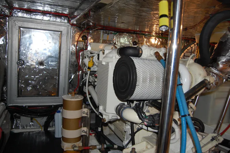 Wandering Bear Yacht Photos Pics Engine room of 2001 Ocean Alexander Classico yacht, featuring machinery and insulation.