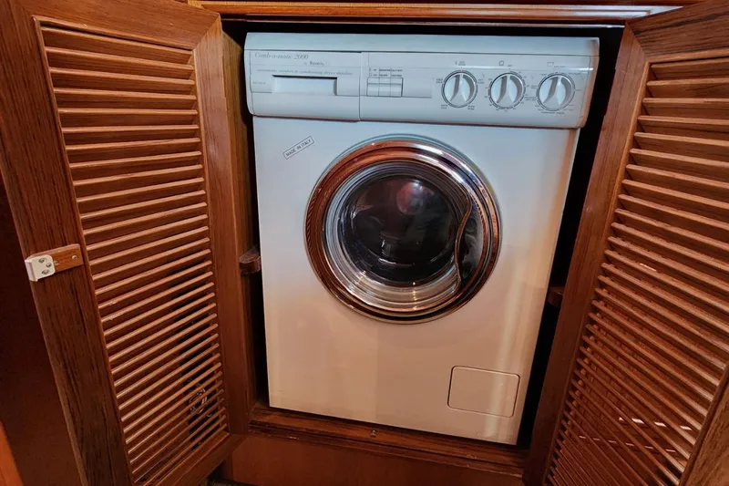 Wandering Bear Yacht Photos Pics Washing machine inside wooden cabinet on 2001 Ocean Alexander Classico yacht.