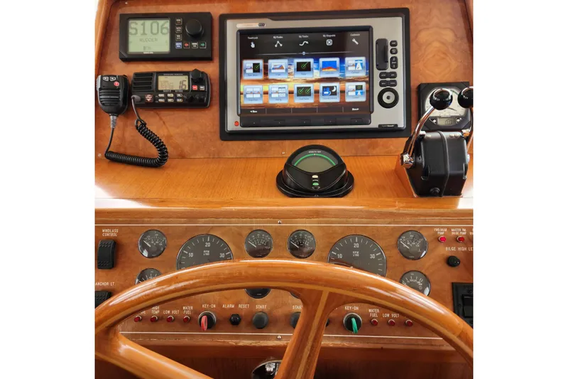 Wandering Bear Yacht Photos Pics Cockpit of 2001 Ocean Alexander Classico yacht with navigation instruments and controls.