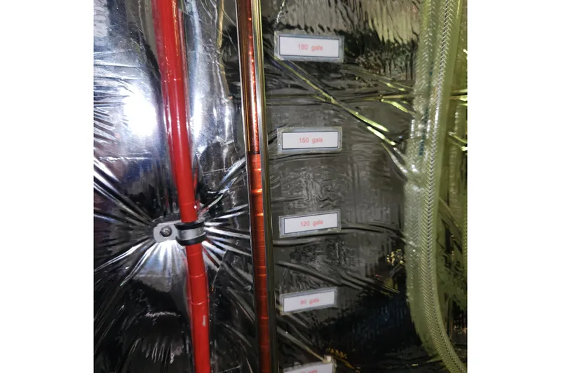 Wandering Bear Yacht Photos Pics Engine room of 2001 Ocean Alexander Classico yacht with labeled fuel gauges.