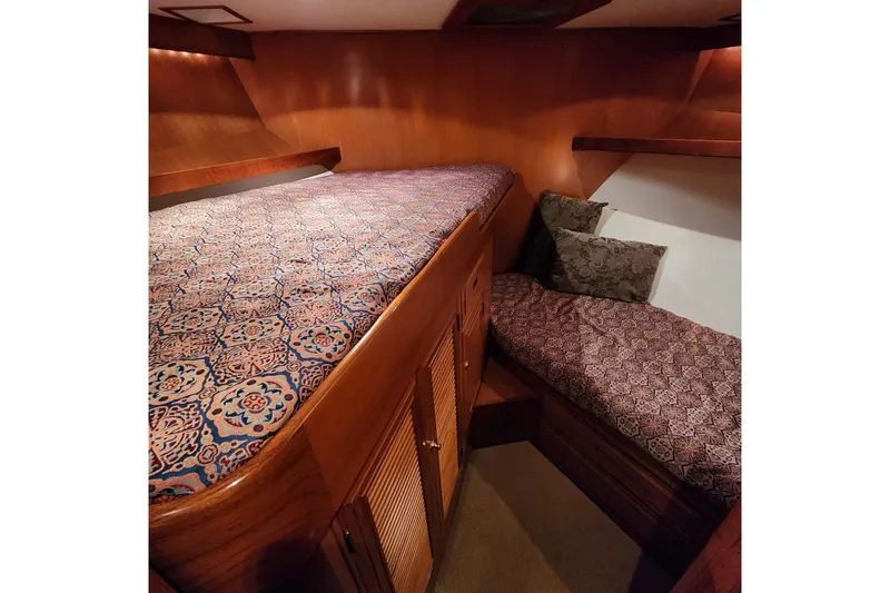 Wandering Bear Yacht Photos Pics Cozy cabin interior of 2001 Ocean Alexander Classico yacht with patterned bedding.