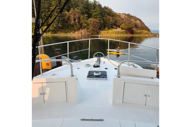 Wandering Bear Yacht Photos Pics Ocean Alexander Classico 2001 yacht deck with scenic waterfront view.