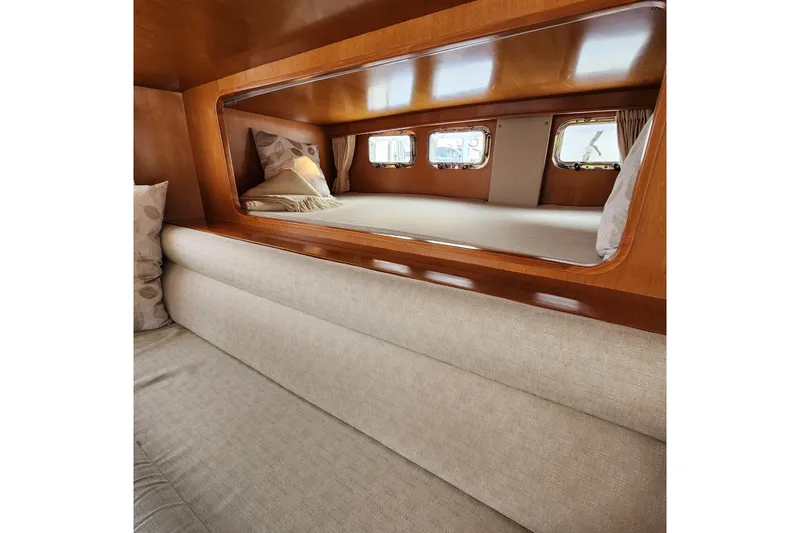 Wandering Bear Yacht Photos Pics Luxurious cabin interior of 2001 Ocean Alexander Classico yacht with elegant wood finish.