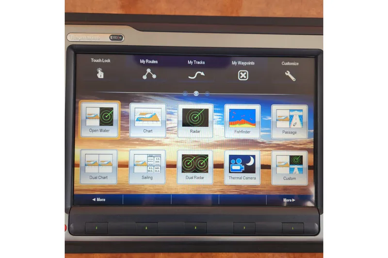 Wandering Bear Yacht Photos Pics Touchscreen navigation system on 2001 Ocean Alexander Classico yacht, displaying various marine applications.