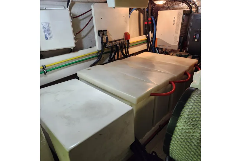 Wandering Bear Yacht Photos Pics Engine room of 2001 Ocean Alexander Classico yacht with electrical systems and storage tanks.