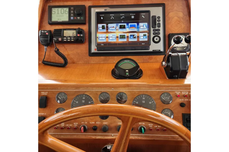 Wandering Bear Yacht Photos Pics 2001 Ocean Alexander Classico helm with navigation controls and display screen.