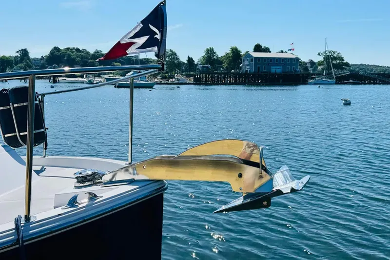 Forever Moor Yacht Photos Pics 2024 True North 34 Outboard Express boat anchored in scenic harbor.