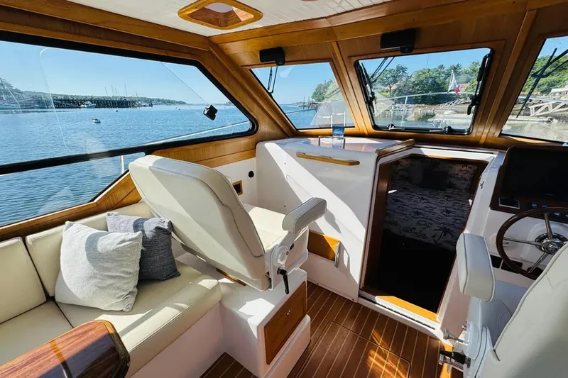 Forever Moor Yacht Photos Pics 2024 True North 34 Outboard Express interior with luxurious seating and scenic water views.