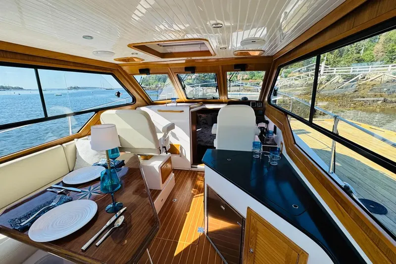 Forever Moor Yacht Photos Pics Luxurious interior of 2024 True North 34 Outboard Express yacht with scenic water views.