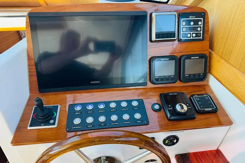 Forever Moor Yacht Photos Pics 2024 True North 34 Outboard Express helm with Garmin display and control panel.