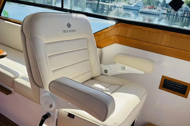 Forever Moor Yacht Photos Pics Luxurious seating on 2024 True North 34 Outboard Express boat, featuring elegant design and comfort.