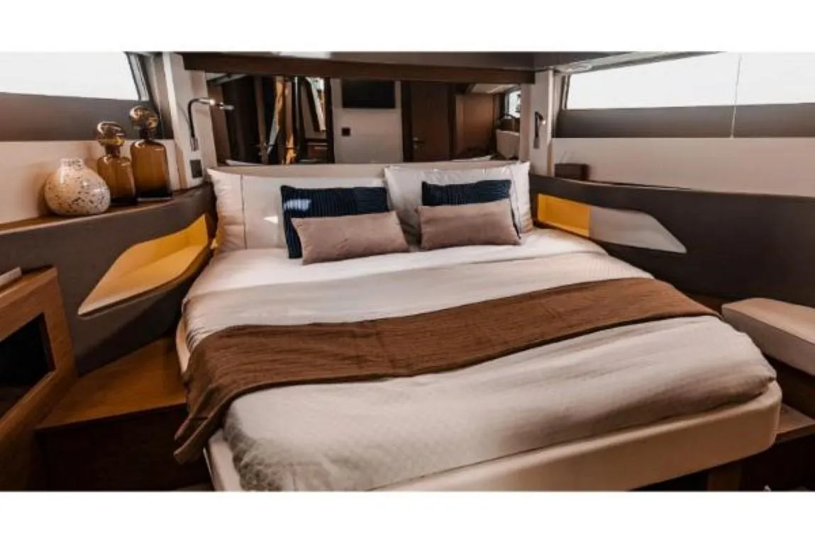 Luxurious bedroom interior of 2025 Wellcraft 44 Explorer yacht with modern design elements.