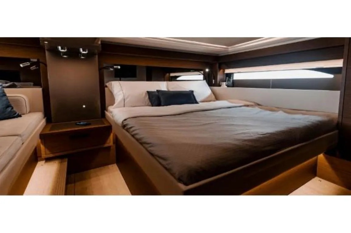 Luxurious bedroom interior of 2025 Wellcraft 44 Explorer yacht with modern design.