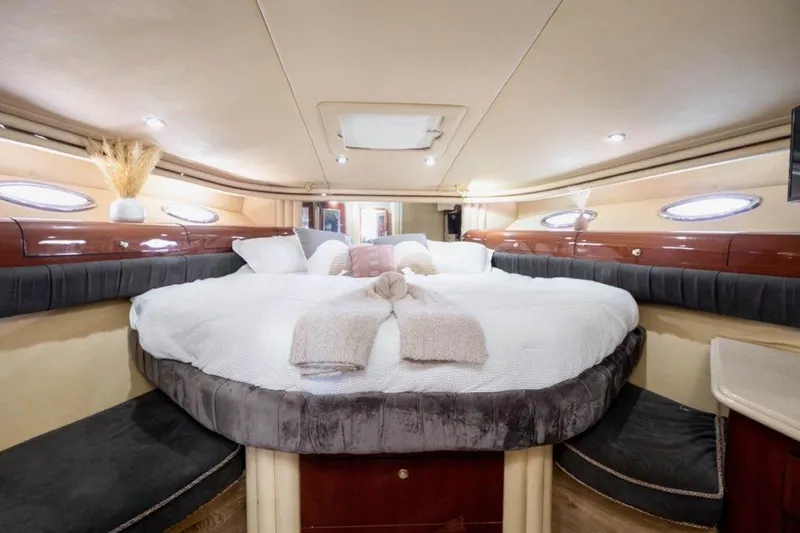  Yacht Photos Pics Luxurious bedroom interior of 2002 Sea Ray 560 Sedan Bridge yacht.