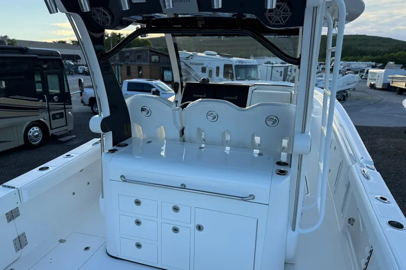  Yacht Photos Pics 2018 Edgewater 370CC boat interior with helm station and storage compartments.