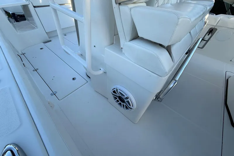  Yacht Photos Pics 2018 Edgewater 370CC boat interior with white seating and speaker detail.