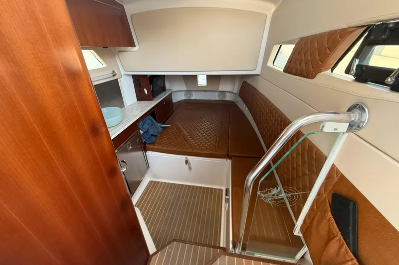  Yacht Photos Pics Interior of 2018 Edgewater 370CC boat with wood and leather finishes.