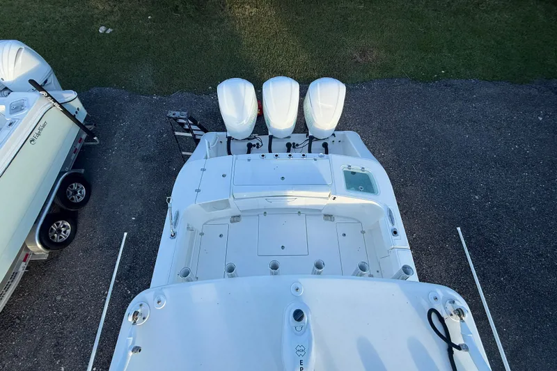  Yacht Photos Pics Top view of a 2018 Edgewater 370CC boat with triple outboard engines.