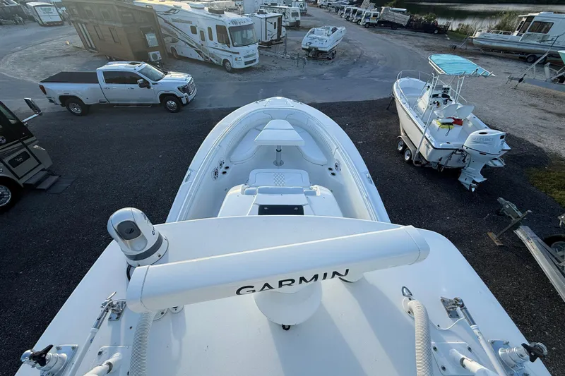  Yacht Photos Pics 2018 Edgewater 370CC boat with Garmin equipment, parked near RVs and other boats.