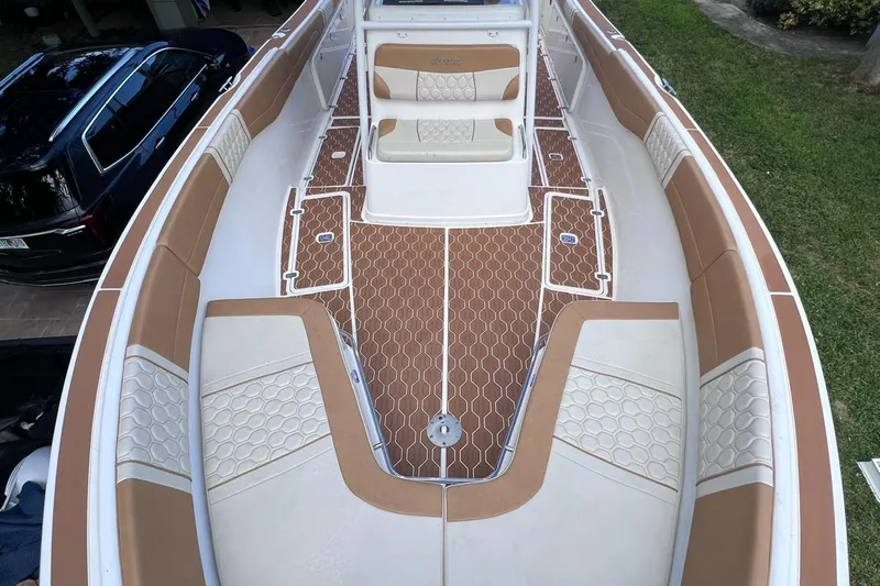  Yacht Photos Pics 2019 Century 3200 Center Console boat with tan and white seating, brown deck, and spacious layout.