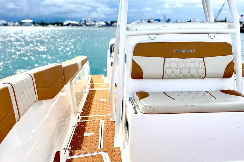  Yacht Photos Pics 2019 Century 3200 Center Console boat interior with tan and white seating, ocean view.