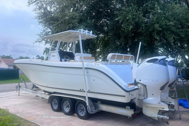  Yacht Photos Pics 2019 Century 3200 Center Console boat on trailer with twin Suzuki outboard engines.