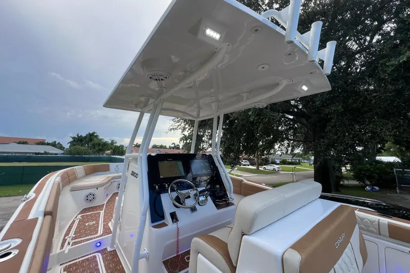  Yacht Photos Pics 2019 Century 3200 Center Console boat interior with helm, seating, and modern controls.